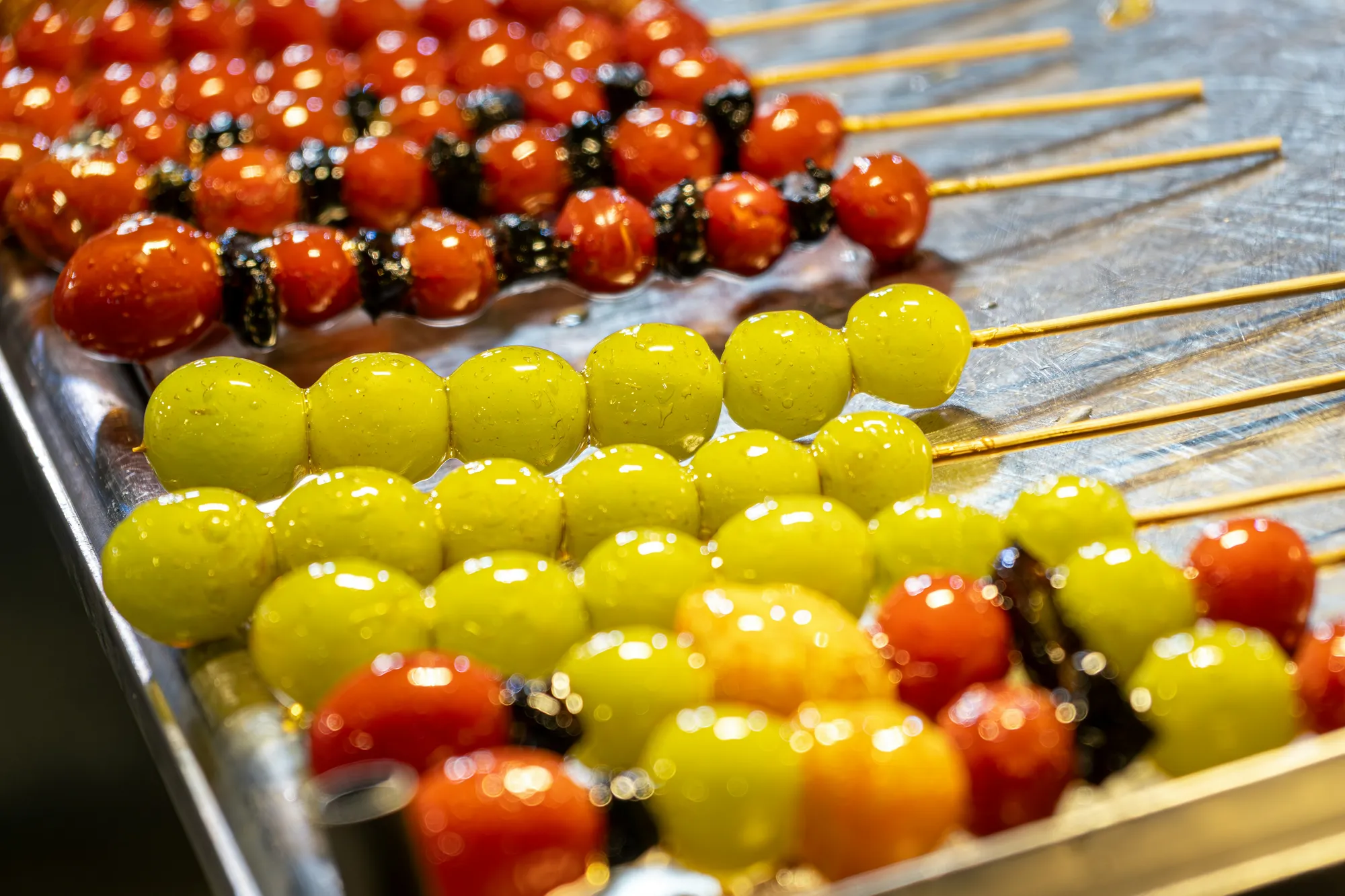 Tanghulu candied hawthorn skewers glistening with a hard sugar shell